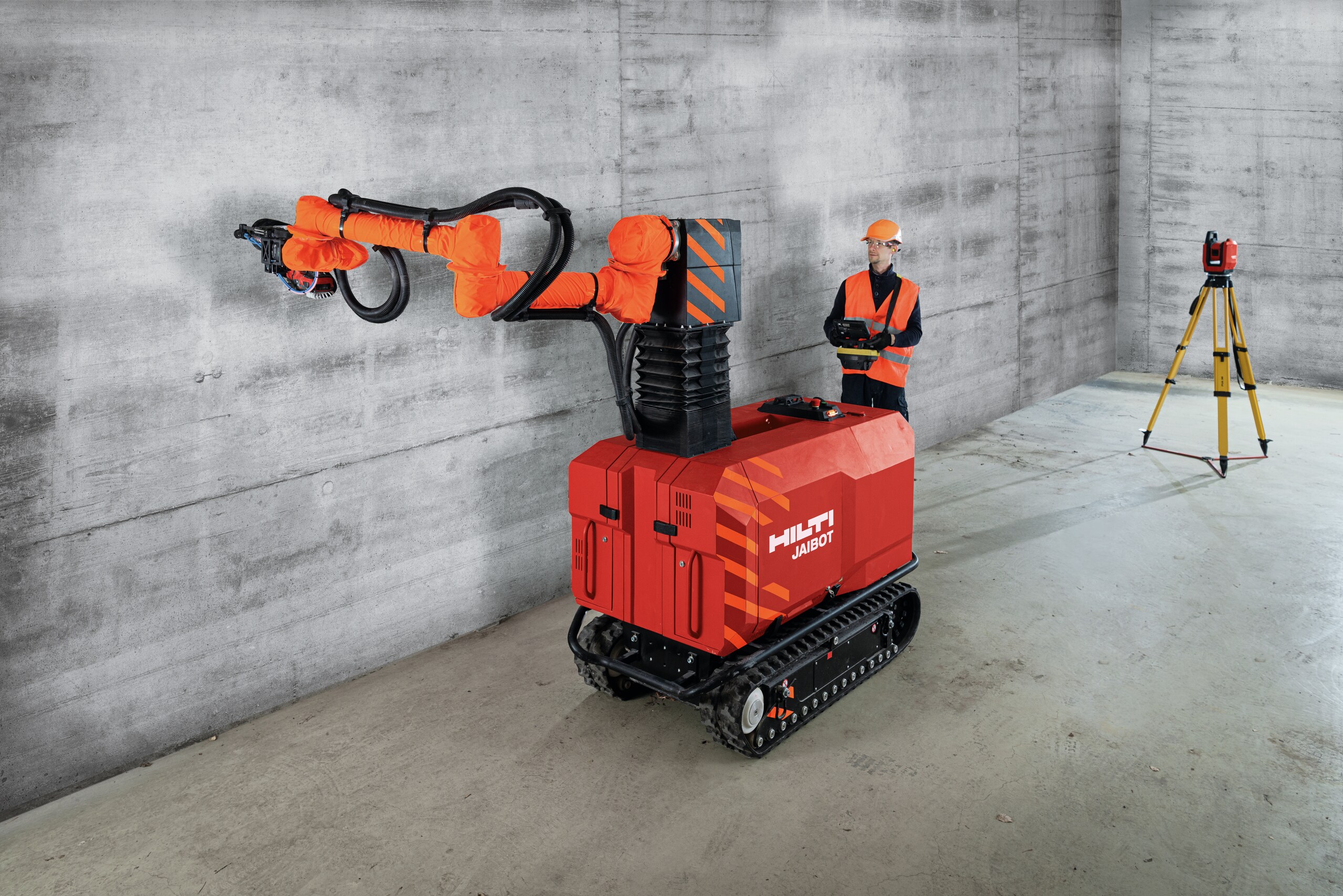 Hilti PLT 300 total station and Jaibot drilling robot on a construction site performing MEP installation.