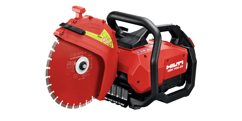 A red and black handheld power cutter with a circular blade, featuring handles for grip. The tool is branded with labels and safety warnings, designed for cutting hard materials like concrete or metal.