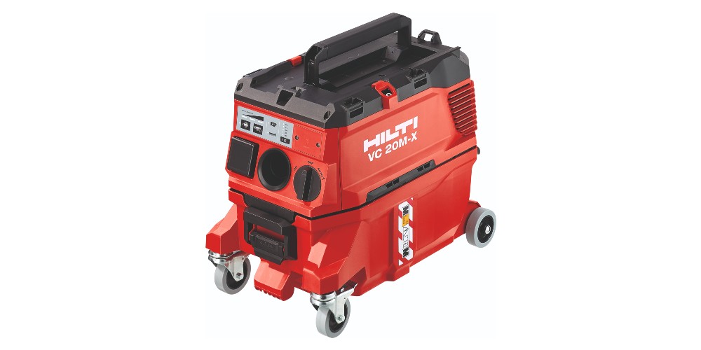 Red and black Hilti VC 20M-X vacuum cleaner with wheels and handle, designed for industrial use. The unit has control buttons and filter compartments visible on the front.
