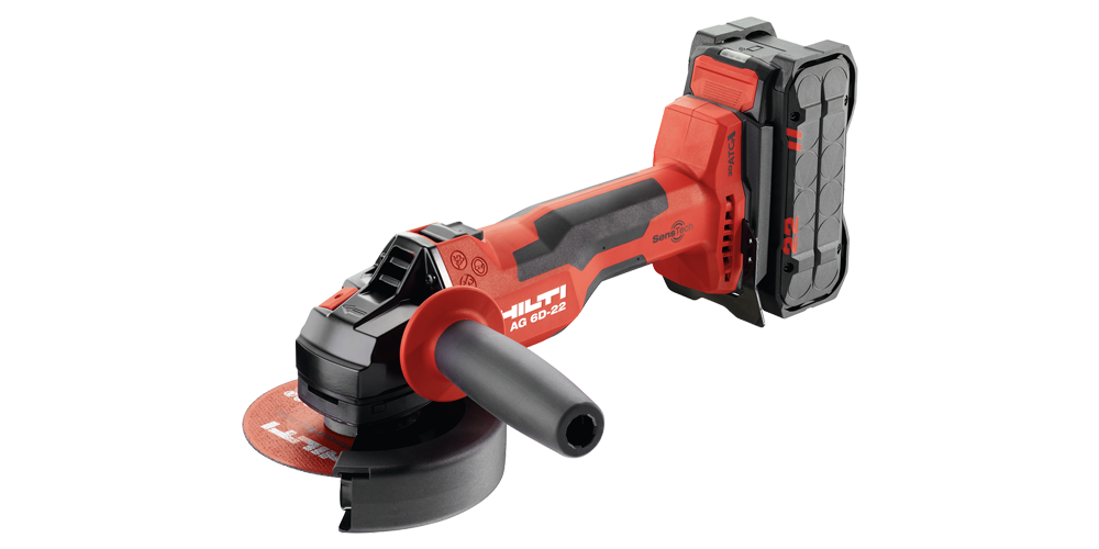 A Hilti AG 6D-22 cordless angle grinder with a red and black design. It features a side handle and battery pack, and has the Hilti logo and text on the equipment.