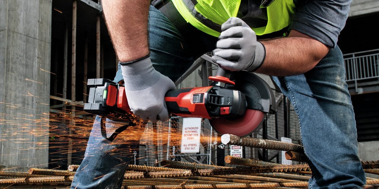 A man in yellow high visibility vest is cutting a rebar with Hilti cordless angle grinder AG 6D-22.