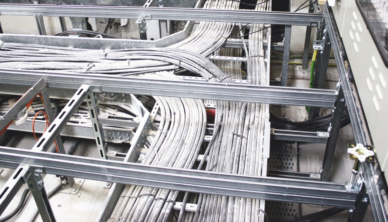 Raised floor solution model - showing metal construction above which is placed floor and under which are cables.