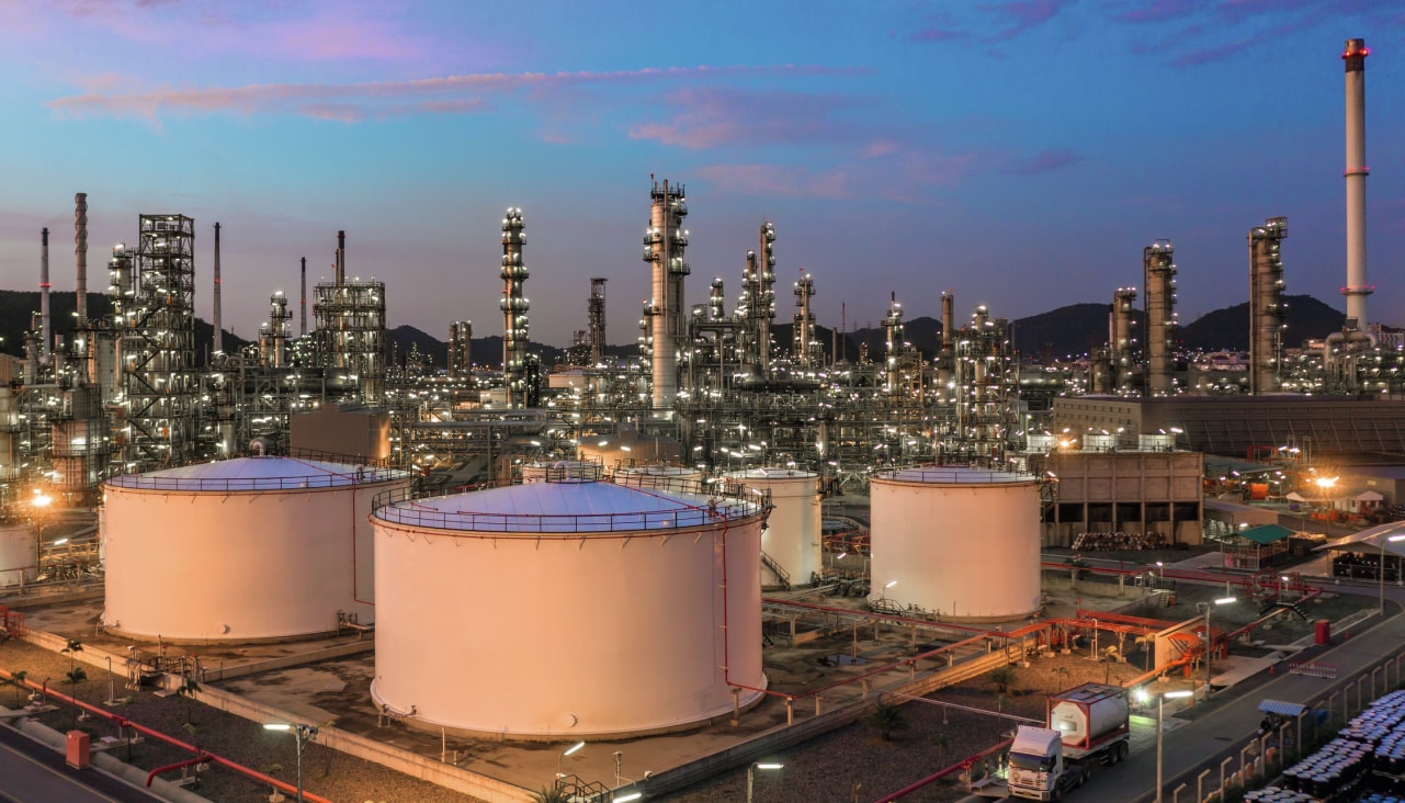 Gas production plants and towers in a sunset golden hour.