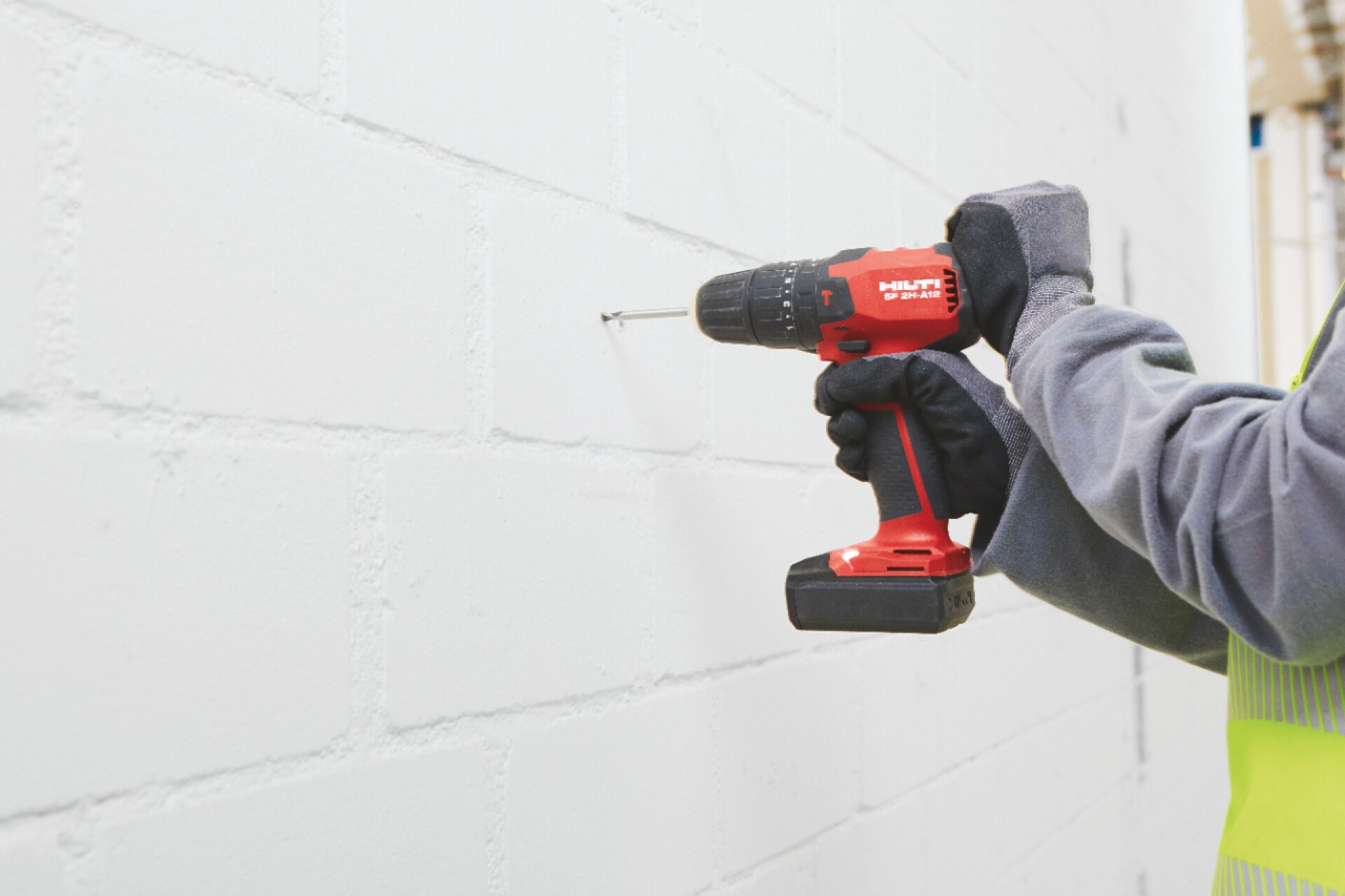 Worker using the Hilti SF 2H-A12 hammer drill