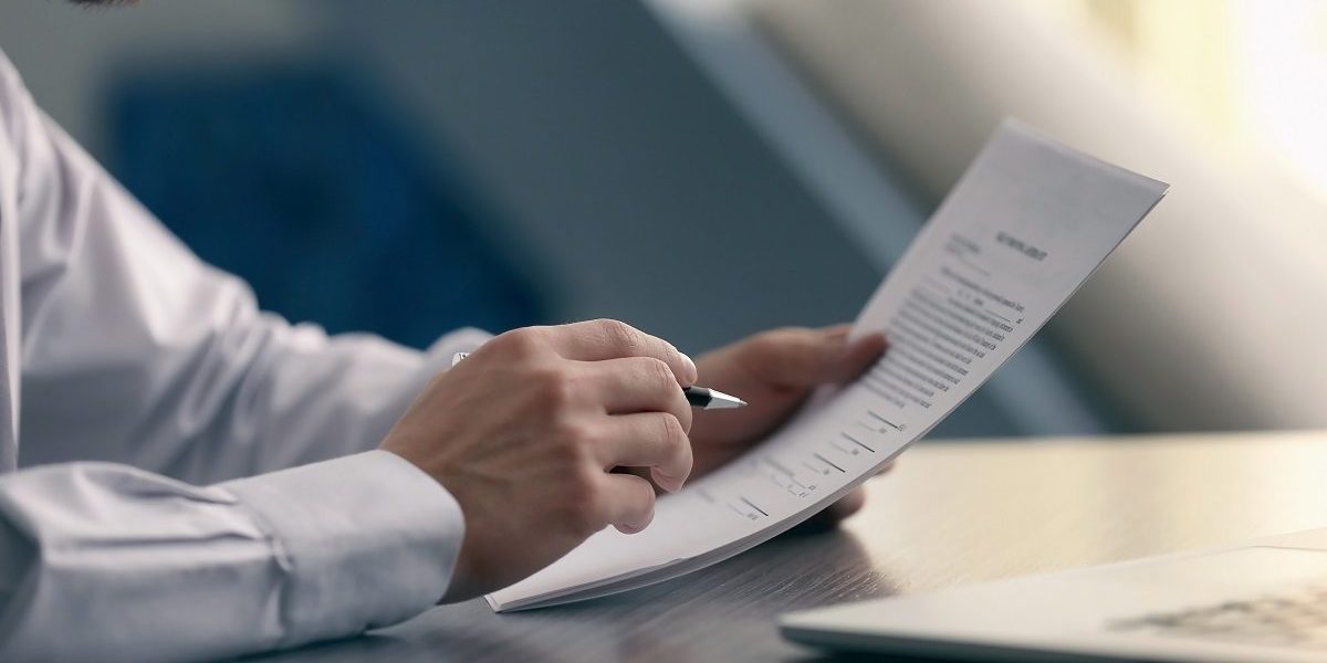 Businessman reading documents; Shutterstock ID 543880450; PO: blog