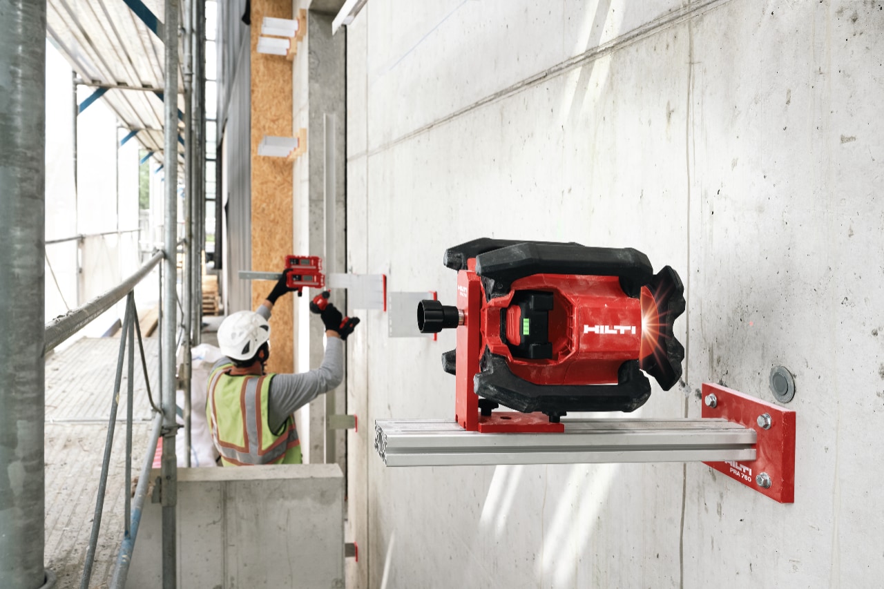Construction worker working with Hilti laser.