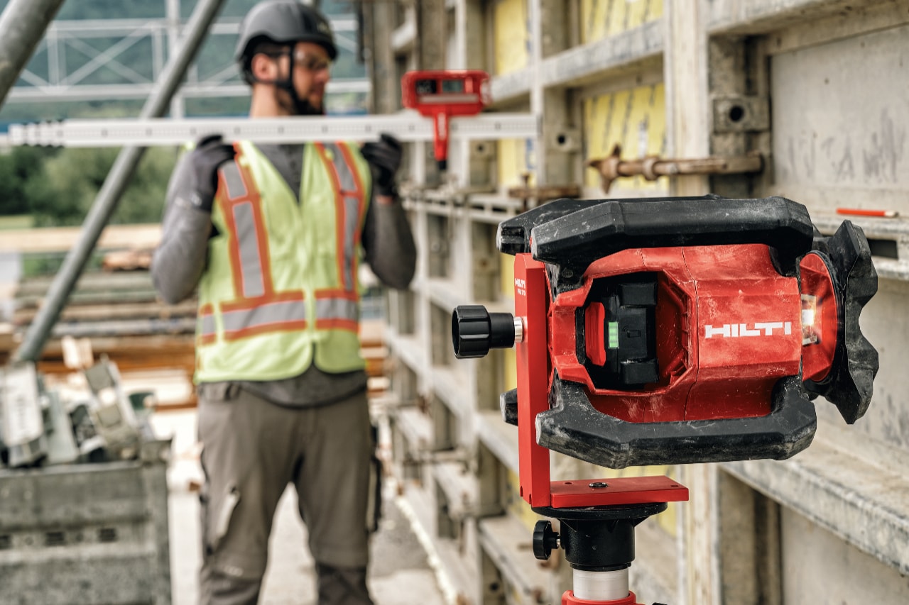 Construction worker using Hilti rotating laser.