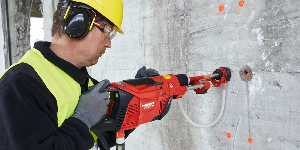 man using Hilti core drill for a rebar application