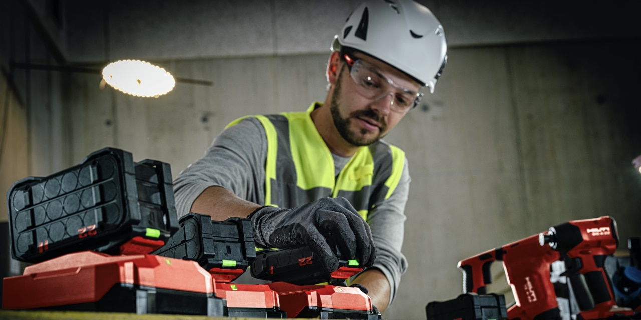 jobsite worker charging batteries