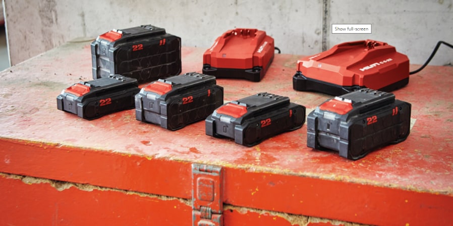 jobsite worker charging batteries