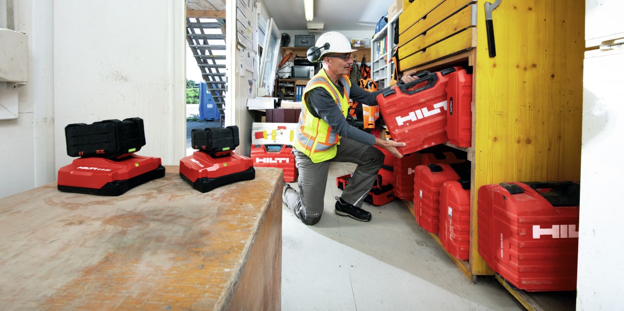 jobsite worker charging batteries