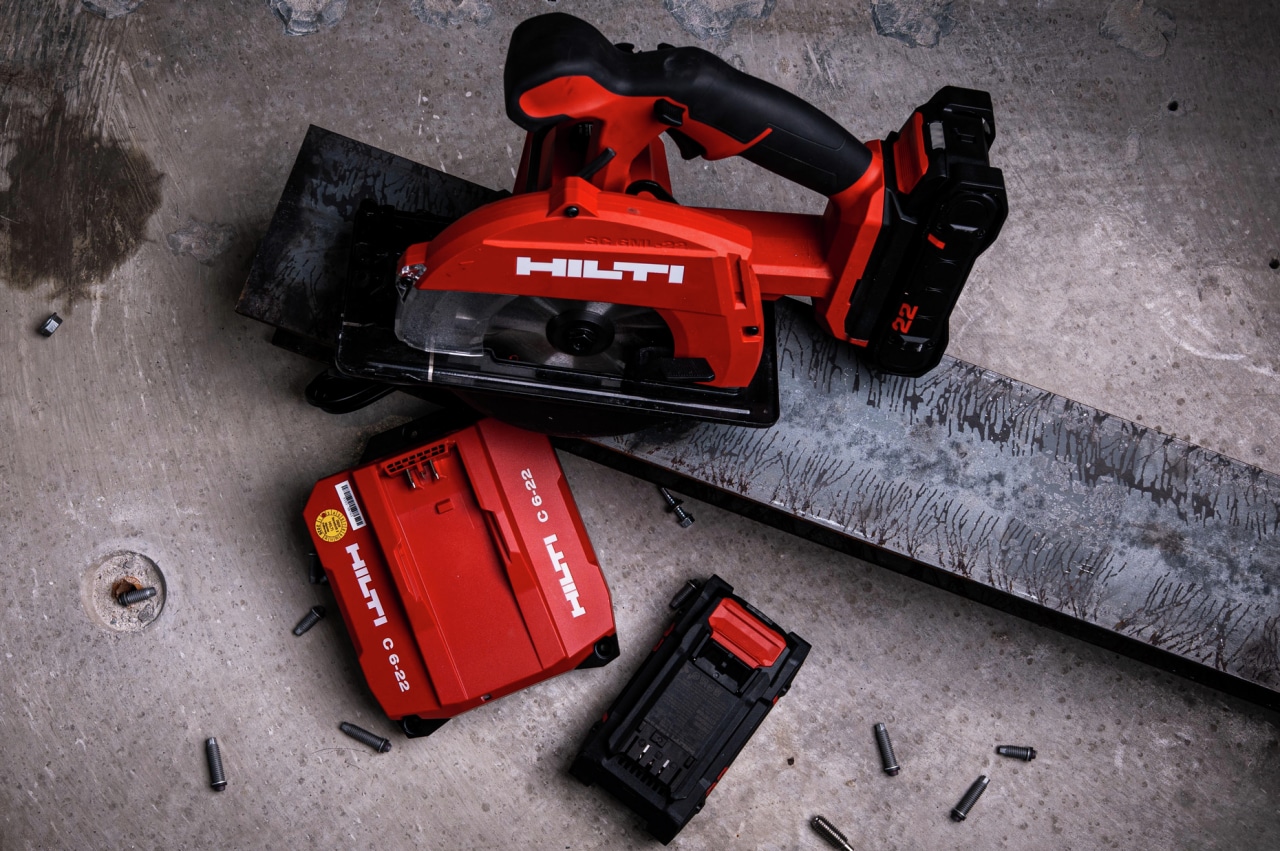 Man using metal cutting tool.