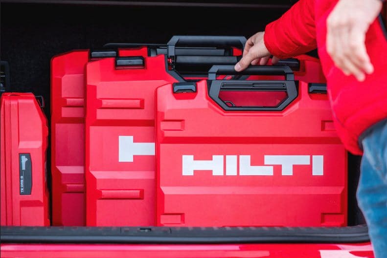 Red tool boxes in the car boot. 