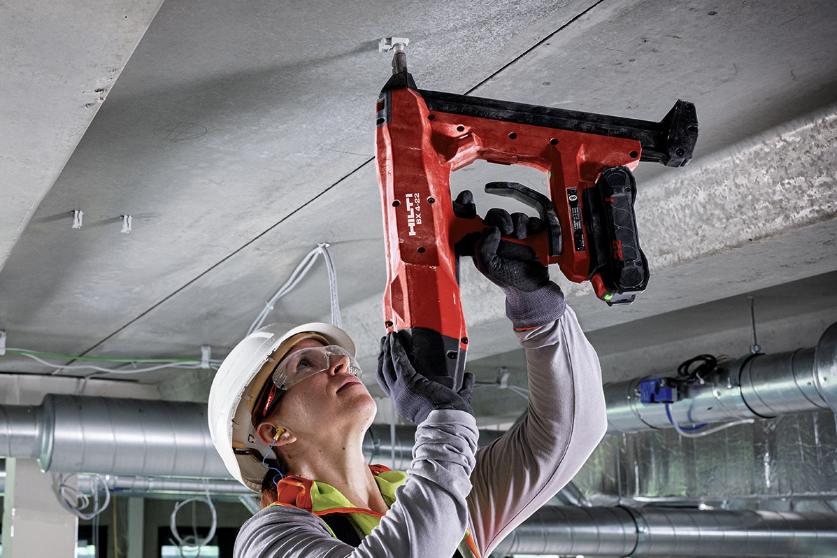 jobsite worker using Hilti nail gun