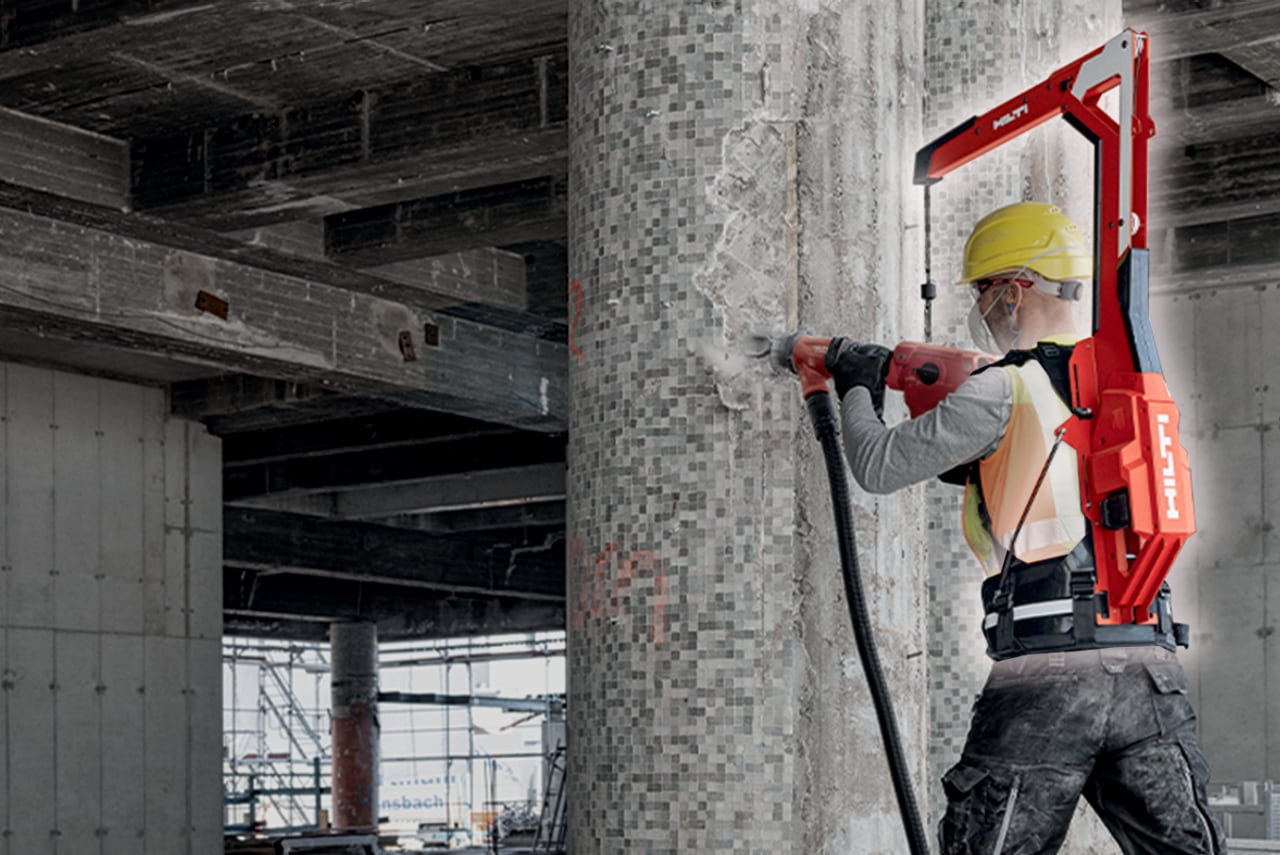 Man using Hilti tool balancer together with a heavy breaker. 