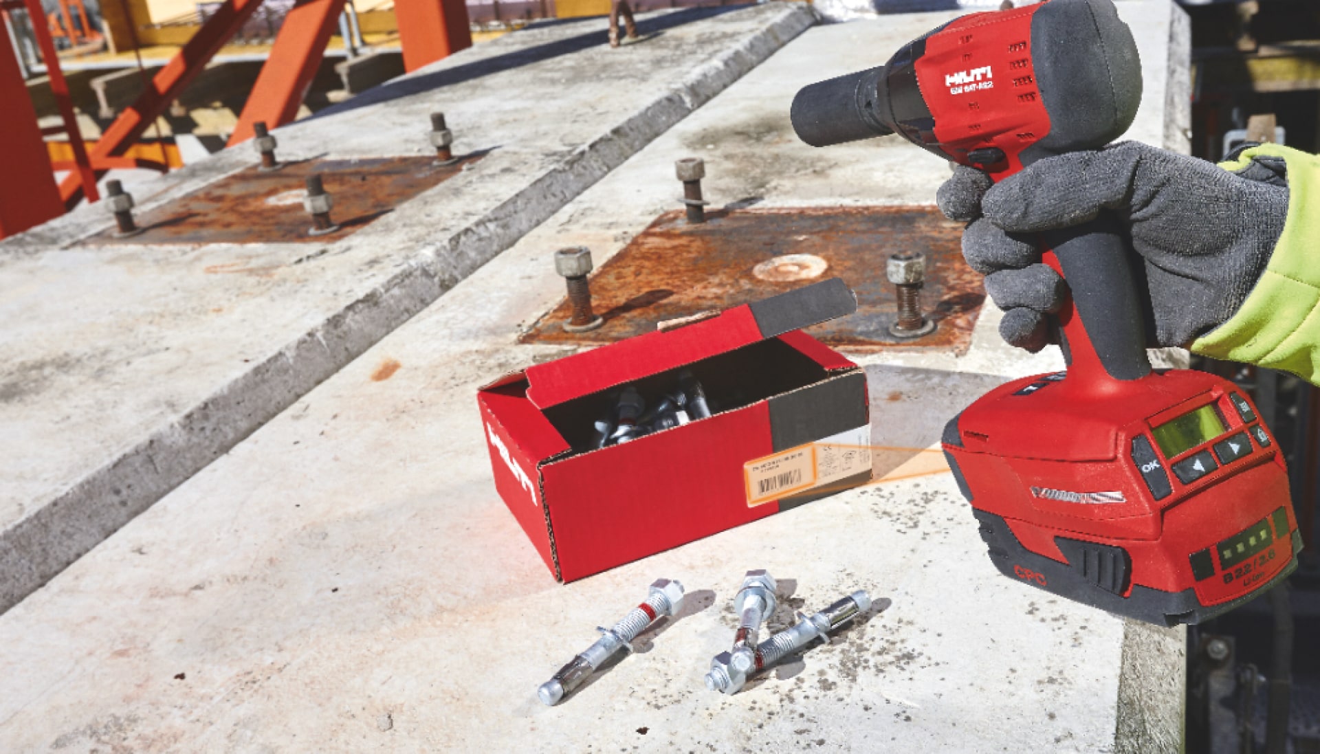 Worker installing Hilti wedge anchors