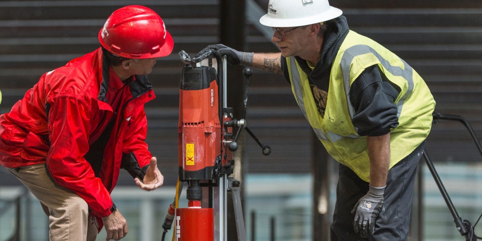 Hilti account manager doing training onsite for a customer with core drill.